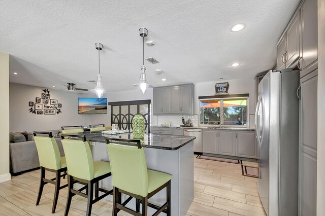 3412 Lake Osborne Dr, Lake Worth Beach, FL 33461 - ranch-style home featuring curved driveway, roof with shingles, board and batten siding, and stucco siding