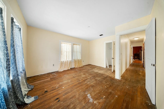 empty room with visible vents and wood-type flooring