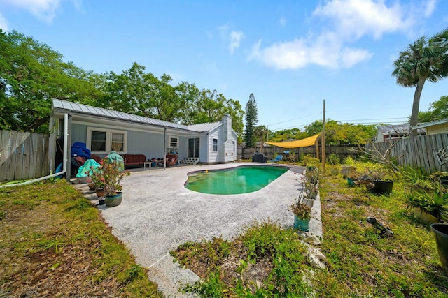 view of pool featuring a fenced backyard and a patio
