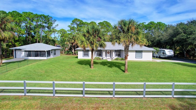 16181 90th St N, Loxahatchee, FL 33470 - view of front of home with a front lawn and a fenced front yard