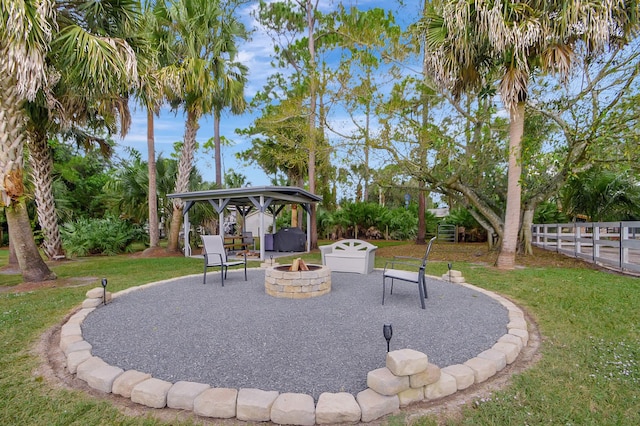 16181 90th St N, Loxahatchee, FL 33470 - view of yard featuring a gazebo, fence, a patio area, and an outdoor fire pit