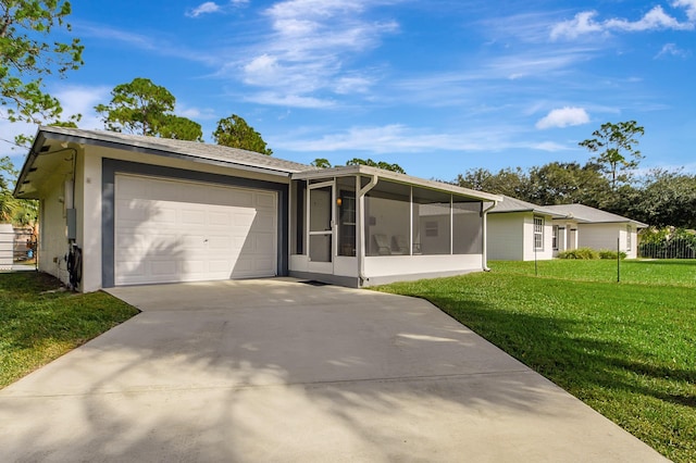 16181 90th St N, Loxahatchee, FL 33470 - view of front of house featuring an attached garage, a sunroom, driveway, and a front yard