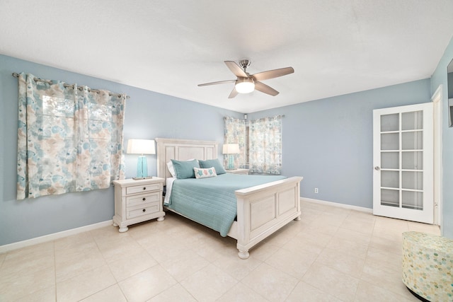 bedroom with light tile patterned floors, baseboards, and ceiling fan