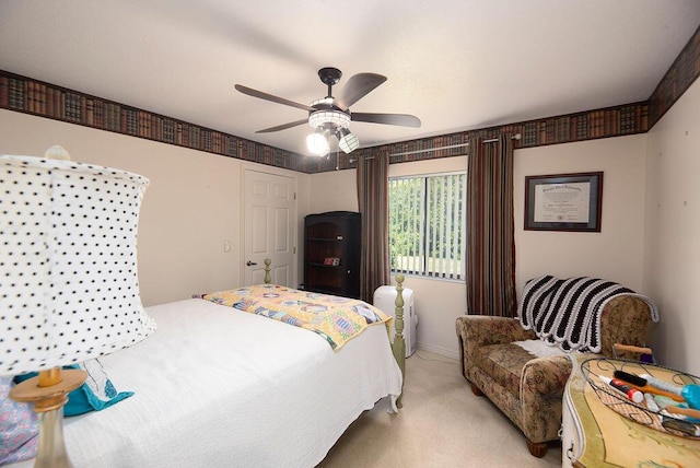 3381 SE E Snow Rd, Port Saint Lucie, FL 34984 - bedroom featuring baseboards, light colored carpet, and ceiling fan