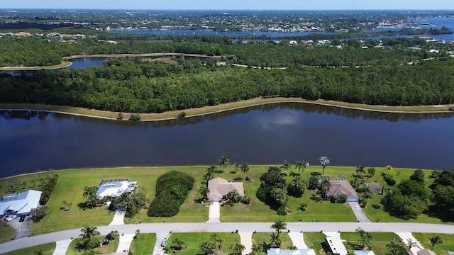 3381 SE E Snow Rd, Port Saint Lucie, FL 34984 - drone / aerial view with a water view and a view of trees