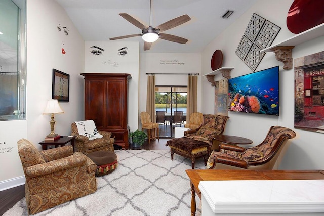 3381 SE E Snow Rd, Port Saint Lucie, FL 34984 - sitting room featuring a ceiling fan, wood finished floors, vaulted ceiling, and visible vents