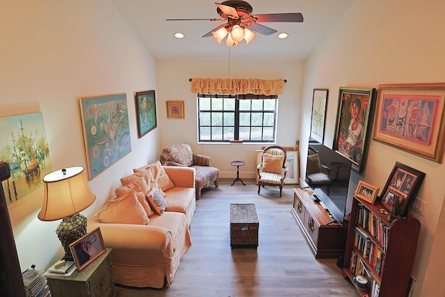 living room featuring ceiling fan, vaulted ceiling, recessed lighting, and wood finished floors