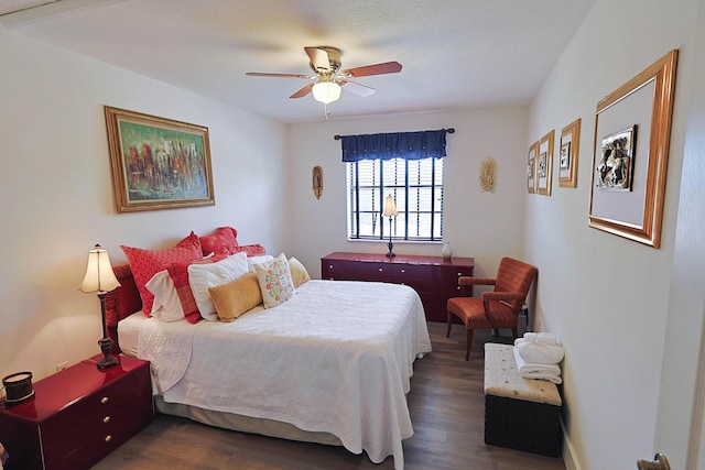 bedroom featuring a ceiling fan and wood finished floors