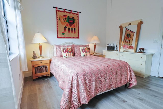 bedroom with wood finished floors