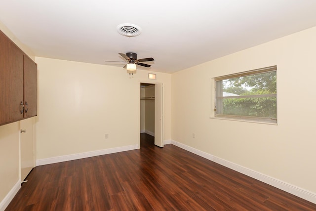 1034 Grandview Blvd, Fort Pierce, FL 34982 - unfurnished bedroom with baseboards, a closet, ceiling fan, dark wood-style floors, and visible vents