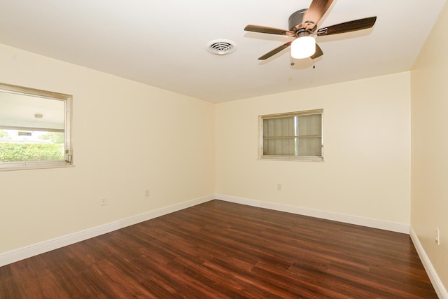 1034 Grandview Blvd, Fort Pierce, FL 34982 - empty room featuring visible vents, ceiling fan, dark wood finished floors, and baseboards