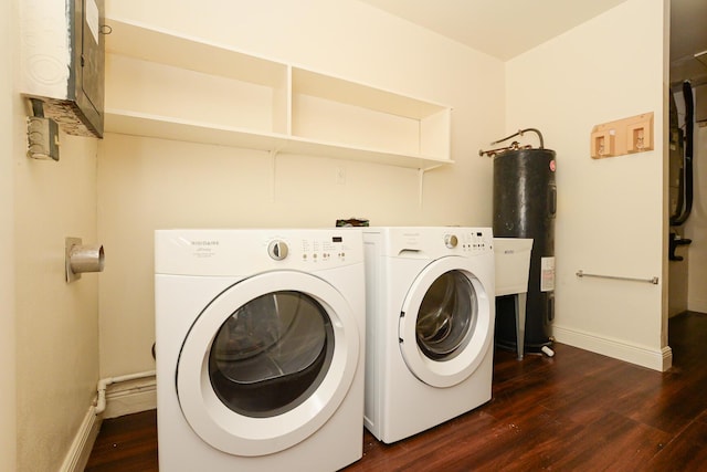 1034 Grandview Blvd, Fort Pierce, FL 34982 - laundry area featuring water heater, washer and dryer, laundry area, and dark wood finished floors