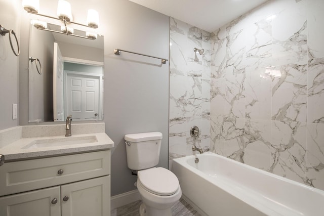 bathroom featuring toilet, vanity, and washtub / shower combination