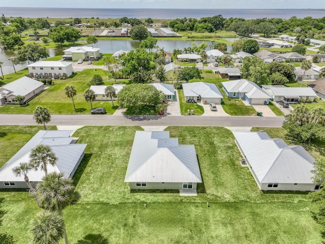 bird's eye view featuring a water view and a residential view