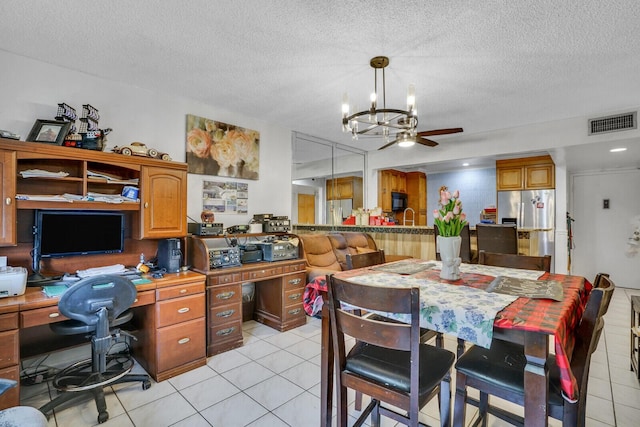 dining area with a chandelier, an office area, light tile patterned flooring, ceiling fan, and a textured ceiling