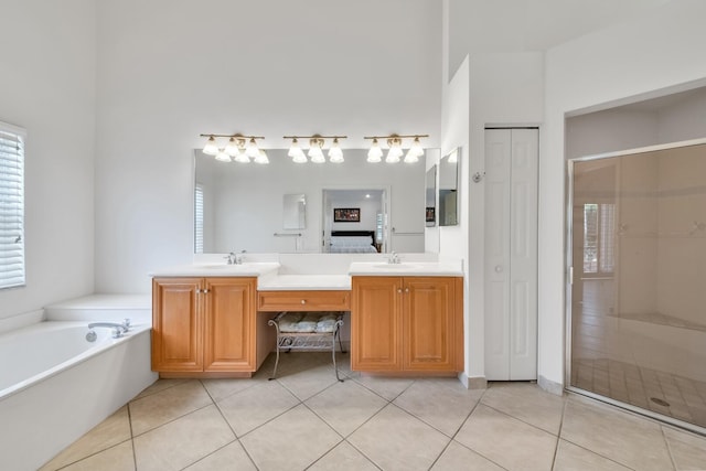 7315 Falls Rd E, Boynton Beach, FL 33437 - full bathroom with double vanity, a sink, tile patterned flooring, and ensuite bath