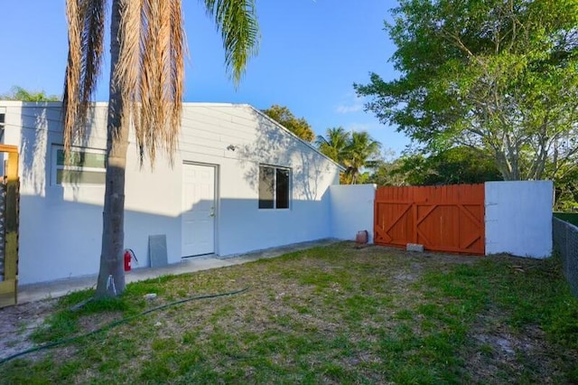 exterior space with a gate and fence