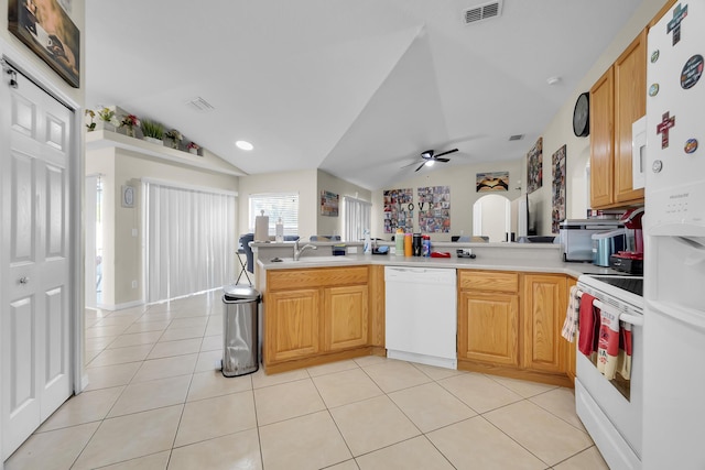 6116 NW Daroco Ter, Port Saint Lucie, FL 34986 - kitchen with a peninsula, light tile patterned flooring, white appliances, ceiling fan, and a sink