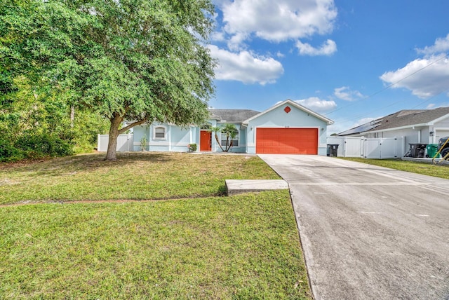 6116 NW Daroco Ter, Port Saint Lucie, FL 34986 - ranch-style home featuring a garage, fence, a front yard, stucco siding, and concrete driveway