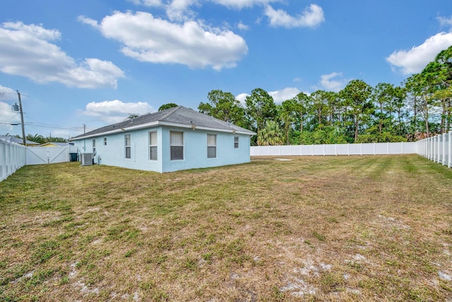 6116 NW Daroco Ter, Port Saint Lucie, FL 34986 - view of yard with a fenced backyard, central air condition unit, and a gate