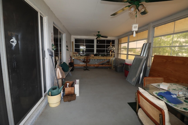 sunroom / solarium with a ceiling fan