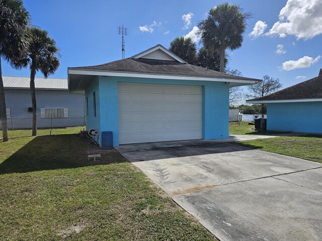 single story home featuring stucco siding, concrete driveway, and a front yard