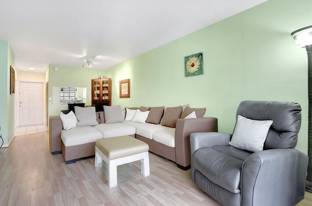 2050 NE 39th St Unit N313, Lighthouse Point, FL 33064 - living room featuring light wood-style floors and rail lighting