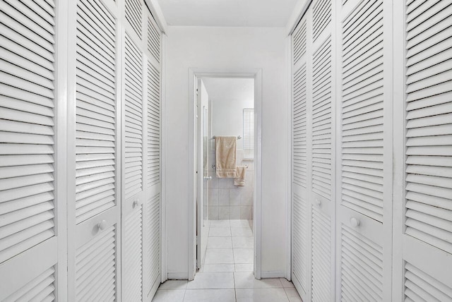 corridor featuring light tile patterned flooring