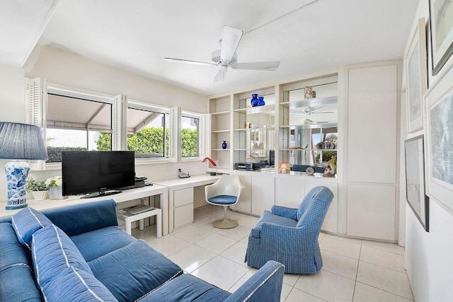 living area featuring light tile patterned flooring and ceiling fan