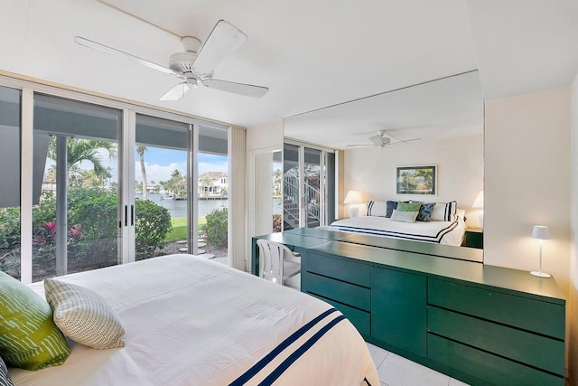 bedroom featuring a water view, floor to ceiling windows, access to outside, tile patterned floors, and a ceiling fan