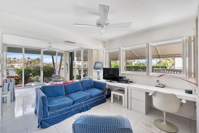 interior space featuring visible vents, ceiling fan, and light tile patterned floors