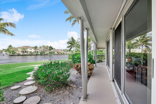 view of patio with a water view and a residential view