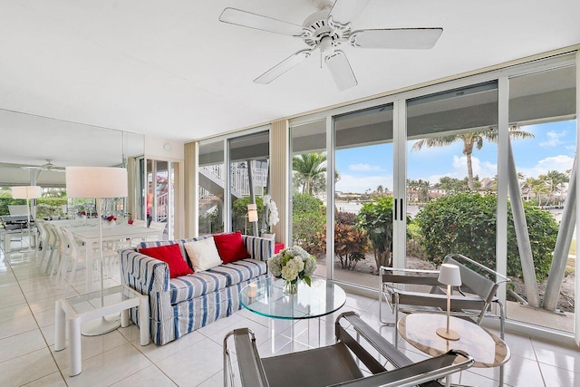 sunroom / solarium featuring tile patterned floors and floor to ceiling windows