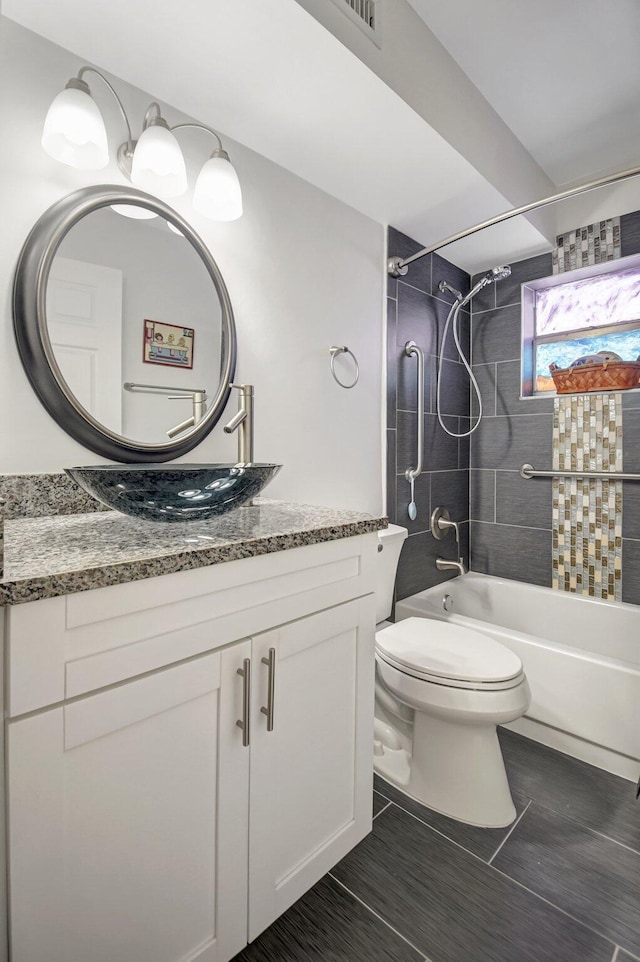 881 Normandy S, Delray Beach, FL 33484 - bathroom featuring toilet, vanity, and shower / washtub combination