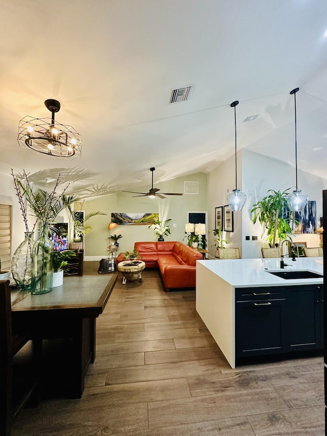 9494 Sun Pointe Dr, Boynton Beach, FL 33437 - dining space featuring wood finished floors, a ceiling fan, and lofted ceiling