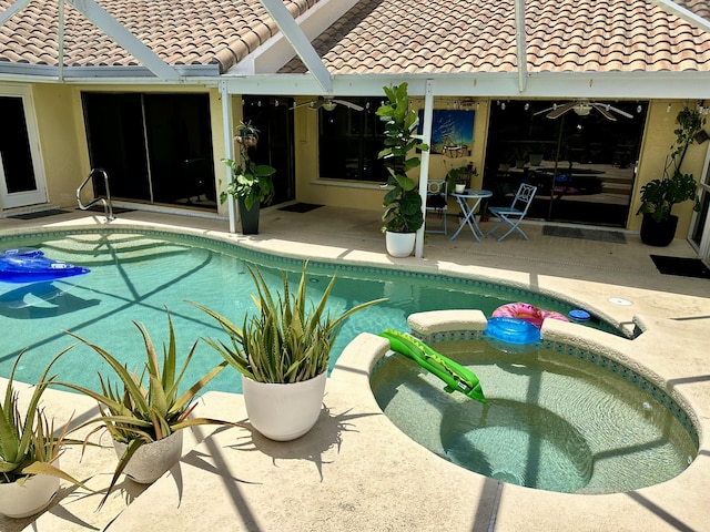 9494 Sun Pointe Dr, Boynton Beach, FL 33437 - outdoor pool with a jacuzzi, a patio, and ceiling fan