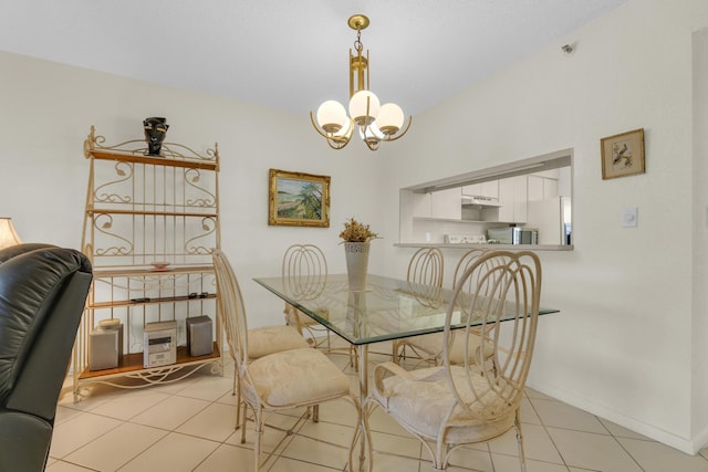 dining room featuring baseboards, light tile patterned floors, and an inviting chandelier