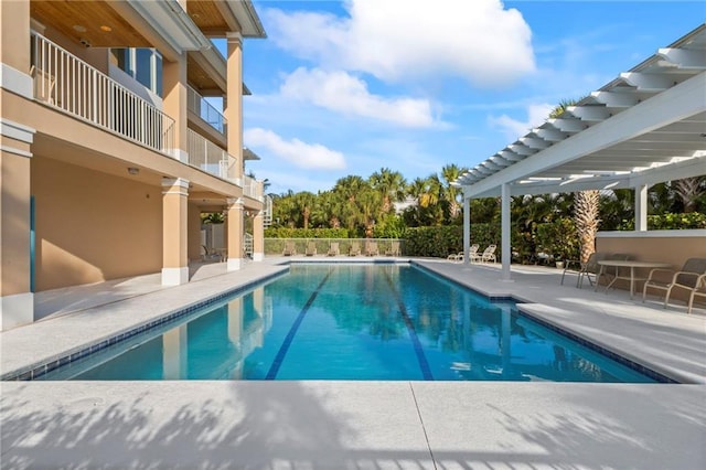 view of pool featuring a fenced in pool, a pergola, and a patio area