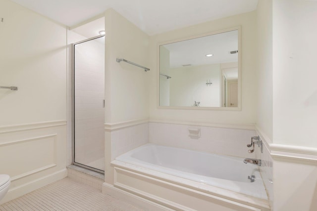 full bath with tile patterned floors, toilet, a shower stall, and a bath