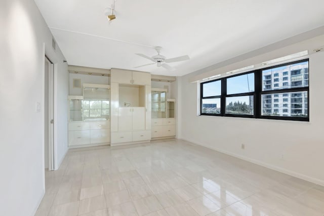 4605 S Ocean Blvd Unit 4C, Highland Beach, FL 33487 - unfurnished bedroom featuring baseboards and ceiling fan