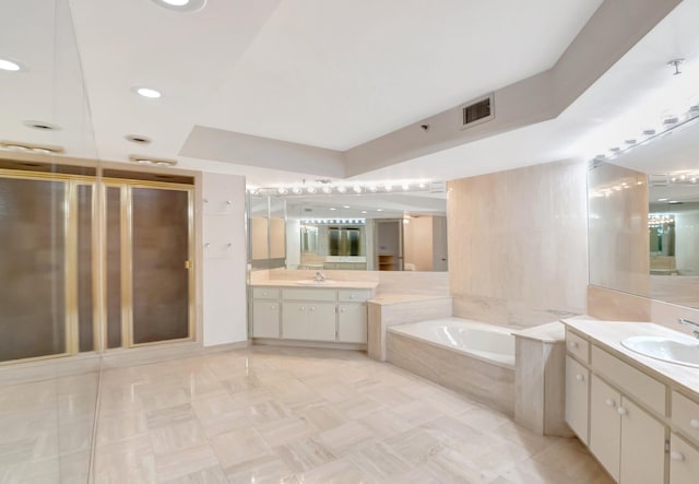 4605 S Ocean Blvd Unit 4C, Highland Beach, FL 33487 - bathroom with a shower stall, a garden tub, and two vanities