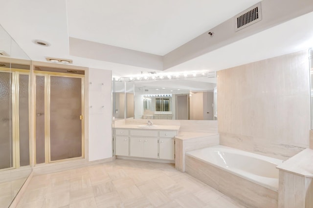 4605 S Ocean Blvd Unit 4C, Highland Beach, FL 33487 - full bath with vanity, a shower stall, and a garden tub
