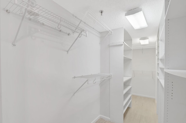 4605 S Ocean Blvd Unit 4C, Highland Beach, FL 33487 - spacious closet featuring light wood-style floors