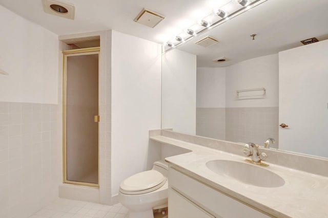 4605 S Ocean Blvd Unit 4C, Highland Beach, FL 33487 - bathroom featuring vanity, a shower stall, toilet, and tile patterned flooring