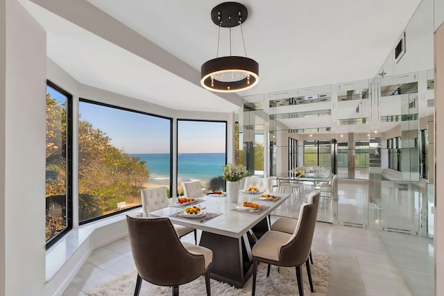 4605 S Ocean Blvd Unit 4C, Highland Beach, FL 33487 - dining area featuring a water view and light tile patterned flooring