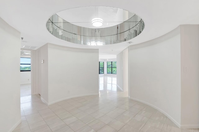 4605 S Ocean Blvd Unit 4C, Highland Beach, FL 33487 - spare room featuring light tile patterned floors and baseboards