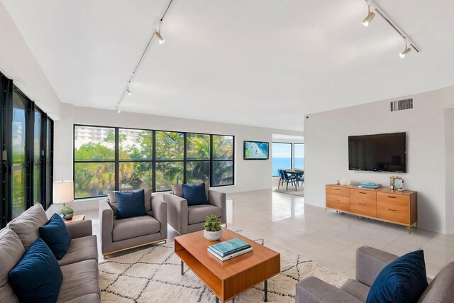4605 S Ocean Blvd Unit 4C, Highland Beach, FL 33487 - living area featuring rail lighting and light tile patterned floors