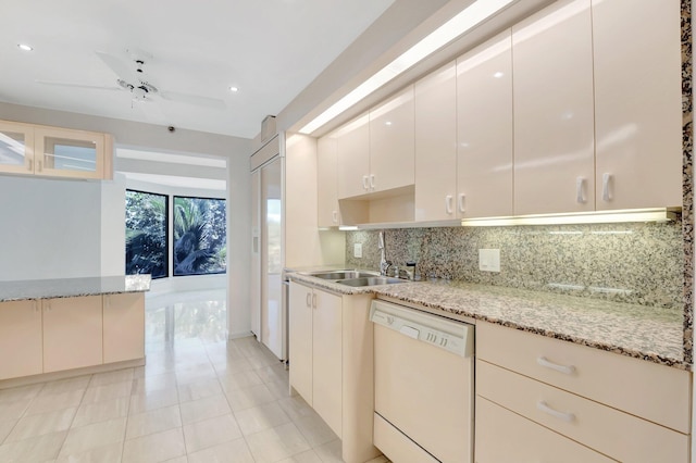 4605 S Ocean Blvd Unit 4C, Highland Beach, FL 33487 - kitchen with white dishwasher, a sink, backsplash, light stone countertops, and recessed lighting