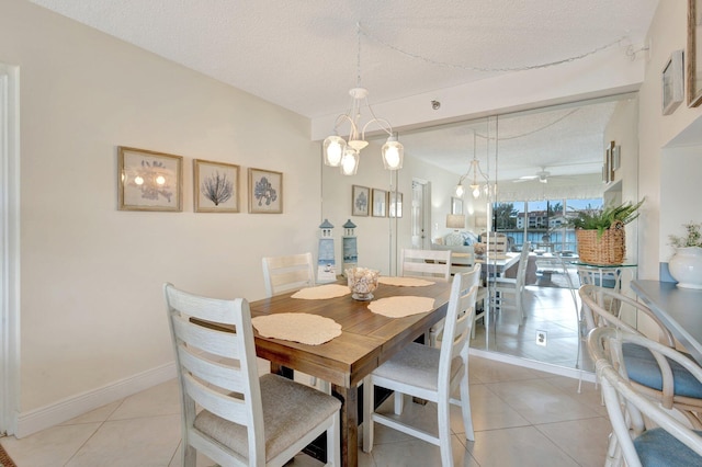4468 NE Ocean Blvd Unit G2, Jensen Beach, FL 34957 - dining space with a textured ceiling and light tile patterned floors