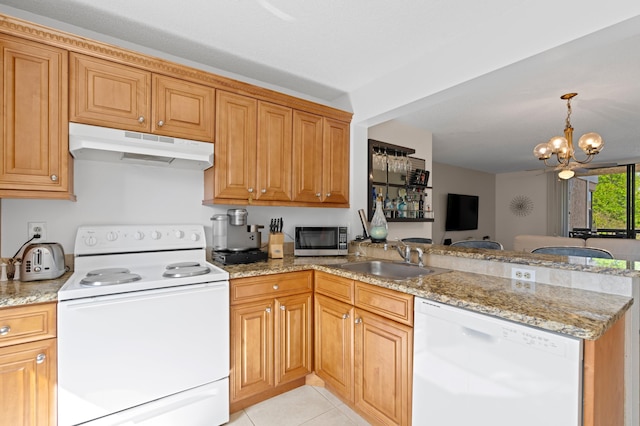 5661 Riverside Dr Unit 206B7, Coral Springs, FL 33067 - kitchen featuring white appliances, under cabinet range hood, a sink, a peninsula, and light stone countertops